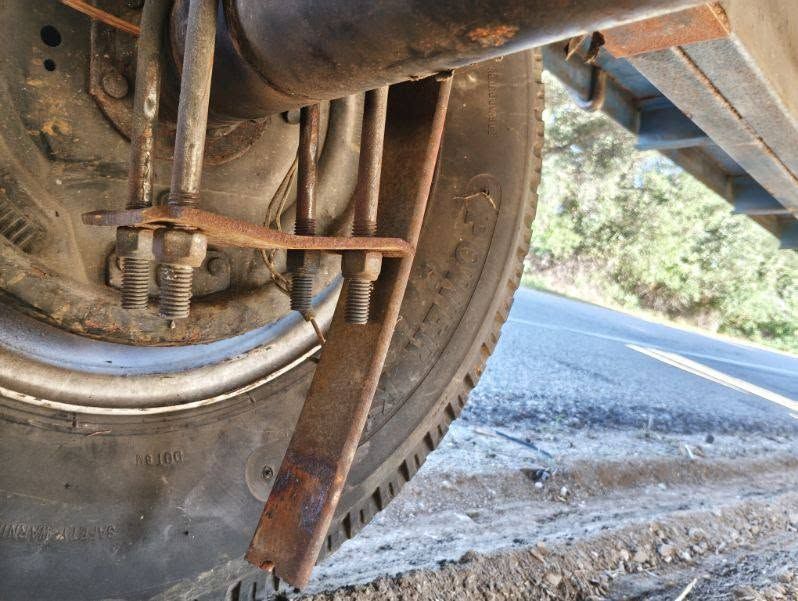 Trailer leaf spring U-bolts and axle seen from underneath