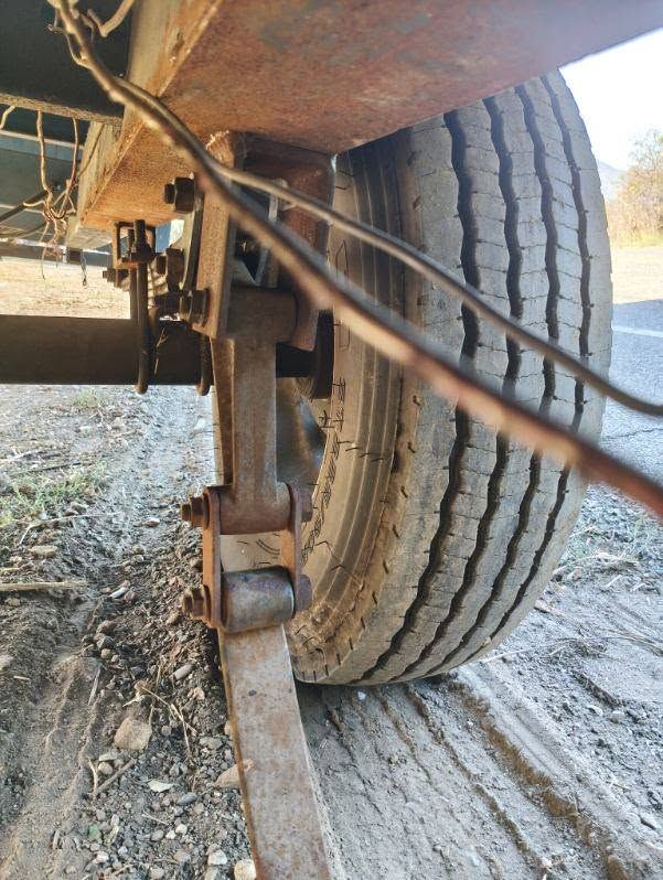 Trailer wheel and leaf spring hanger seen from underneath